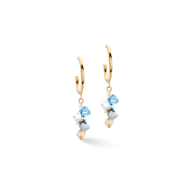Dansende kristallen Aqua. Een spannende mix van sprankelende kristallen en gouden lussen die elke outfit laten stralen.