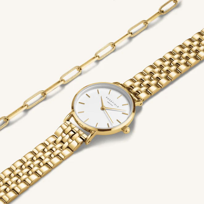 Cadeauset bevat de wit met goudkleurige Small Edit en de Hammered Chainlink Armband. Optioneel: Maak je cadeau speciaal met de cadeau verpakking die beschikbaar is in je winkelwagen.