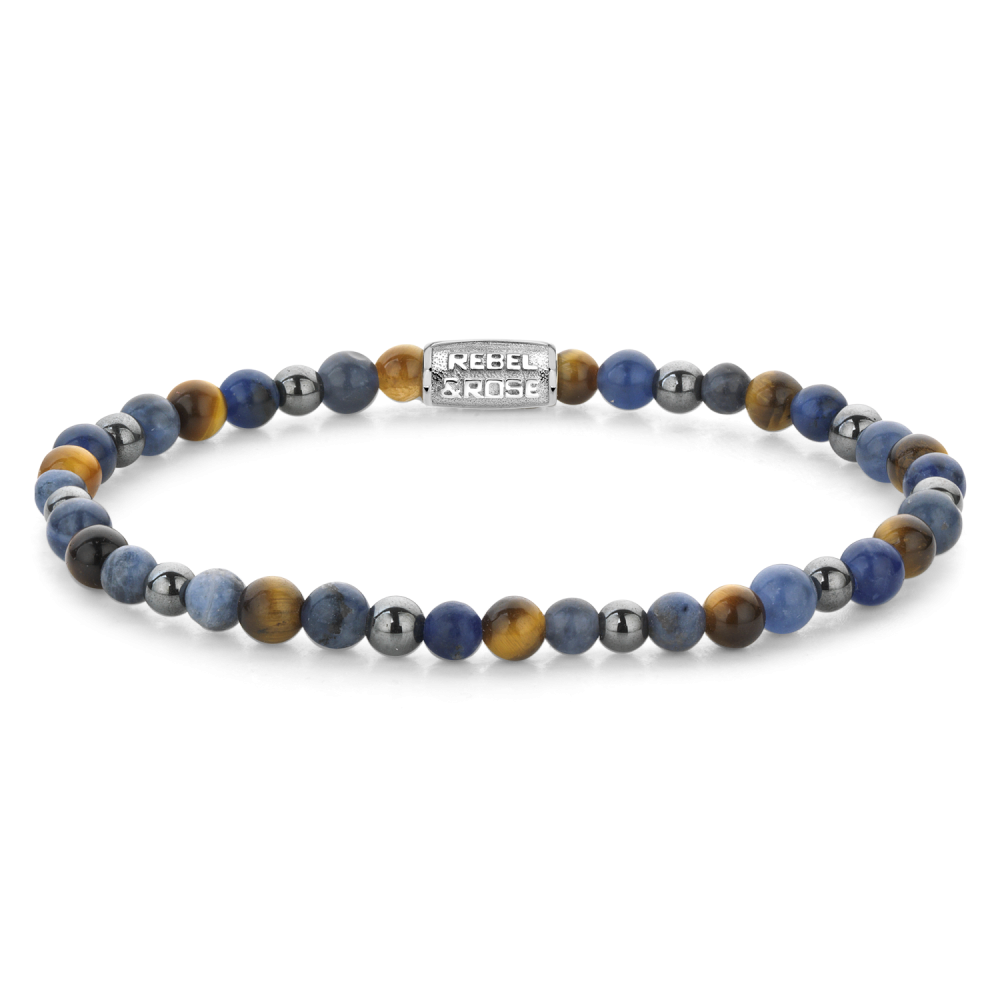 Omschrijving
Edelstenen bead armband, handgemaakt van 4mm Sodaliet, gele Tijgeroog, blauwe Tijgeroog en grijze Hematiet stenen. De sluiting is van stainless steel. Het Rebel & Rose sieraad is makkelijk te combineren met andere zilveren, leren of kralenarmbanden.