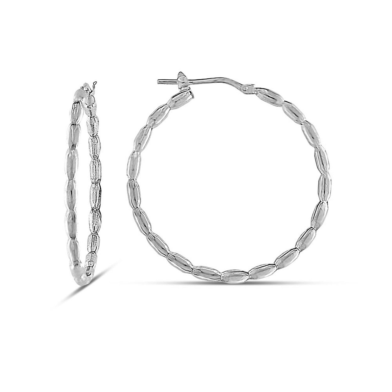 Dit is een oorring van het merk MY iMenso in de kleur zilver.