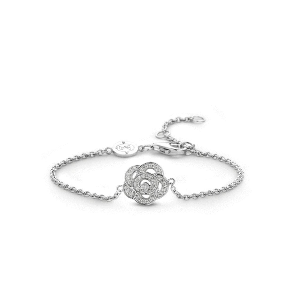 Bent u op zoek naar een subtiel en vrouwelijke armband? Dan is deze smalle armband van TI SENTO - Milano een mooie keuze. De armband van gerhodineerd sterling zilver heeft een prachtig opengewerkte bloemvorm in het midden. De bloemvorm is gezet met briljant geslepen zirkonia's die voor een betoverende schittering zorgen. Wanneer de armband op zichzelf gedragen wordt maakt dit de outfit helemaal af maar deze armband leent zich er ook prima voor om te combineren met andere armbanden om dezelfde pols als een mooie toevoeging. Deze armband met bloemvorm is een deel van een serie uit de collectie. In deze serie zijn oorbellen ringen oorbedels en colliers te verkrijgen met dezelfde bloemvorm.
