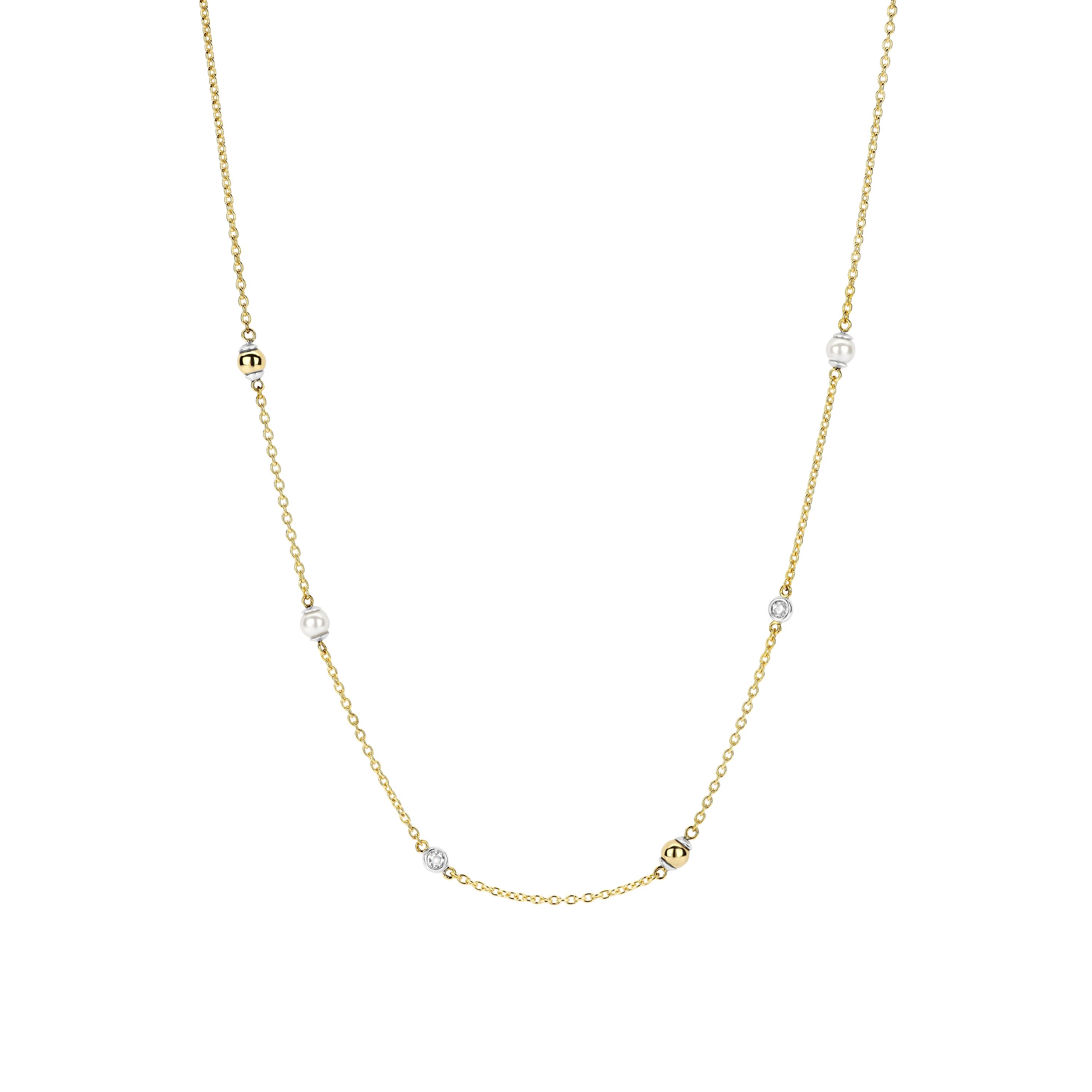 De TI SENTO ketting 34097ZY is een delicate compositie van moderne luxe, ge�nspireerd door de gouden warmte van de zomer. Gemaakt van hoogwaardig 925 sterling zilver, is de vergulde ketting versierd met glanzende witte parels, gepolijste kralen en bezel gezette cubic zirconia stenen. Elk element weerspiegelt de stralende zon, waardoor een verfijnde maar moeiteloze gloed ontstaat.

Ontworpen voor elegante gelaagdheid of een subtiele look, vangt deze ketting de essentie van zonovergoten dagen en sterren verlichte nachten, waardoor het een perfecte metgezel is voor elke zomeroutfit. Nikkelvrij en hypoallergeen, het zorgt voor luxueus comfort bij elk draagmoment. Laat deze goudkleurige schoonheid je look verlichten met tijdloze verfijning en moeiteloze elegantie.
