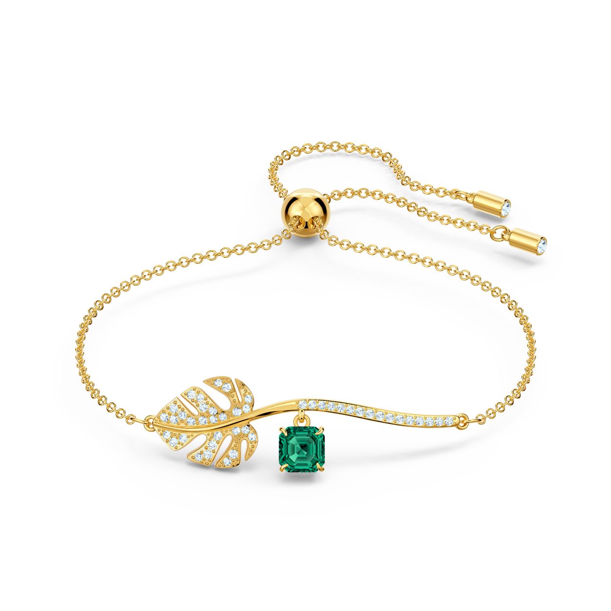 Deze prachtige armband van Swarovski is geinspireerd op de schoonheid van de tropische tuin. Een blad versierd met een goudkleurige toplaag en witte Swarovski-kristallen vormt het middenstuk van het design. Een groot, vierkantig, groen kristal bungelt aan het blad, wat een vleugje glamour en kleur toevoegt. Deze prachtige armband is een geweldig cadeau-idee voor speciale momenten.