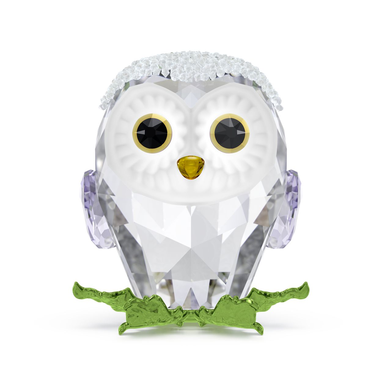 Met zijn heldere brede ogen en besneeuwde kop is dit uilskuiken onweerstaanbaar charmant. Het ornament is geïnspireerd op de Idyllia-lijn en bestaat uit 226 facetten en ongeveer 420 Crystal Rocks. De uil zit op een tak die is gemaakt van metaal met een groene afwerking. Een betoverend stuk dat zeker vreugde brengt in uw interieur. Decoratief voorwerp. Geen speelgoed. Niet geschikt voor kinderen onder de 15 jaar.