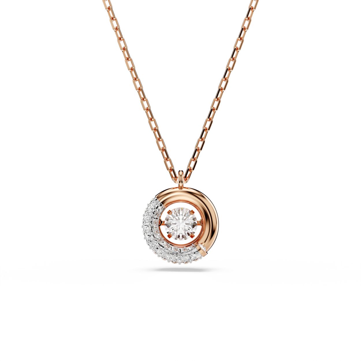 Deze fascinerende Dextera-hanger laat de schoonheid van beweging zien. Het ontwerp met roségoudkleurige toplaag hangt aan een delicate ketting met karabijnsluiting en bestaat uit een centrale ring waarvan de helft is bezet met een pavé van heldere kristallen en een dansende Swarovski Zirkonia in het midden. Combineer het met een bijpassende set oorbellen voor een vreugdevolle, extravagante look.