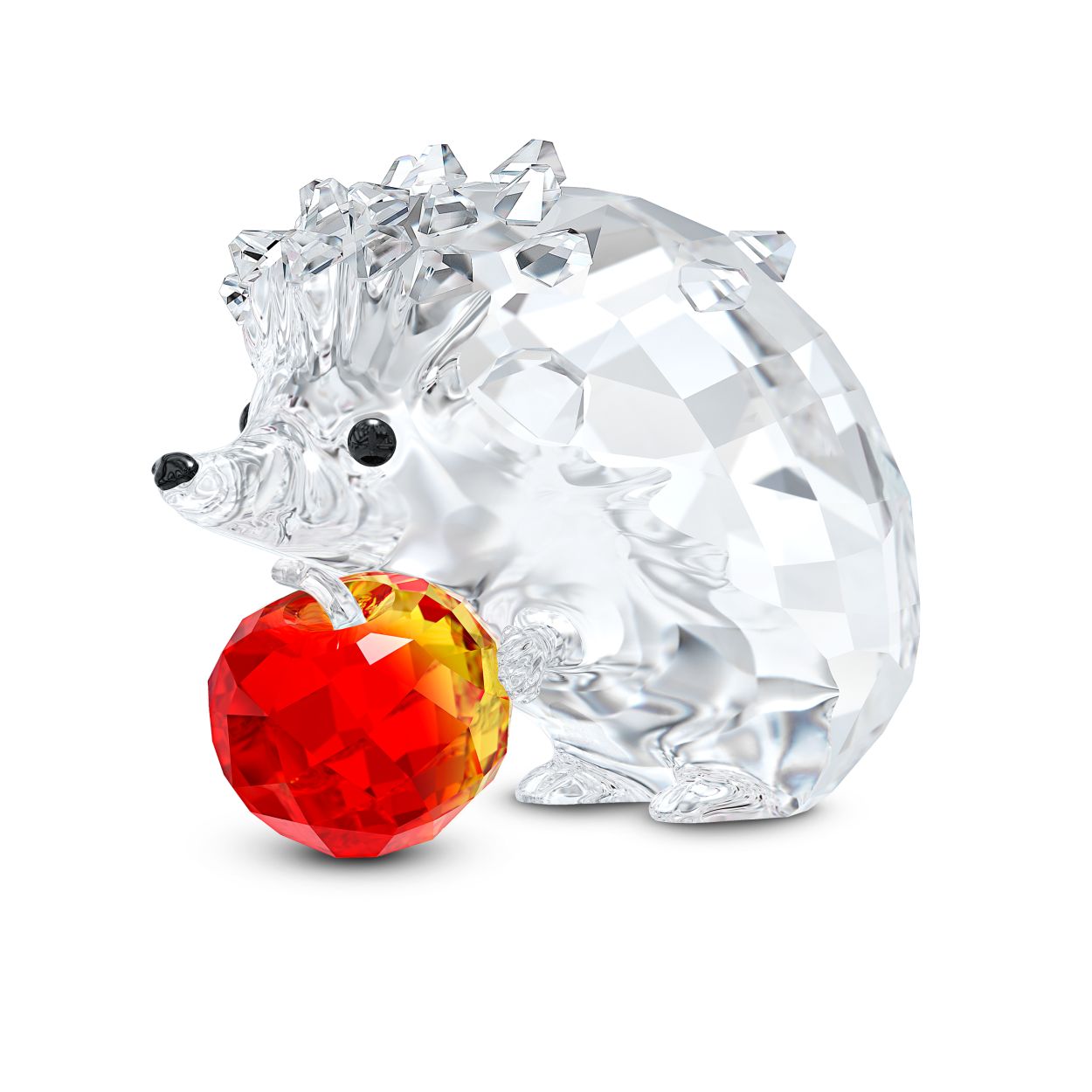 Deze Swarovski-egel heeft eindelijk zijn favoriete fruit te pakken gekregen. De egel heeft een appel tussen zijn pootjes geklemd en zijn houding en uitdrukking lijken levensecht. Hij is gemaakt van helder kristal in 538 facetten en heeft schattige zwarte kraaloogjes en een zwart neusje. De appel geeft het geheel een kleurrijk accent. De appel heeft een uniek kleurverloop van vurige roodtinten dat bij elke egel weer anders is. Elke egel is dus uniek. Een geweldig cadeau voor verzamelaars en liefhebbers van de natuur en dieren. Decoratief voorwerp. Geen speelgoed. Niet geschikt voor kinderen onder de 15 jaar.