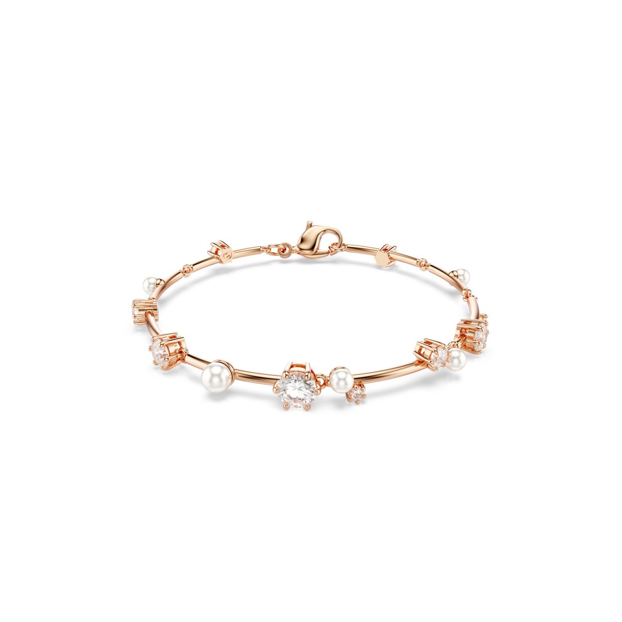 Straal als de sterren met deze glinsterende Constella-armband. Het ontwerp met rosegoudkleurige toplaag is geinspireerd op de wonderen van de nachtelijke hemel en bestaat uit een cluster van Swarovski Zirkonia en Swarovski Crystal Pearls in verschillende formaten, die tussen de metalen staafjes van het sieraad lijken te zweven. De handige karabijnsluiting zorgt voor een comfortabele pasvorm rond de pols. Combineer het met andere Constella-sieraden om uw eigen kosmische aura te creeren.