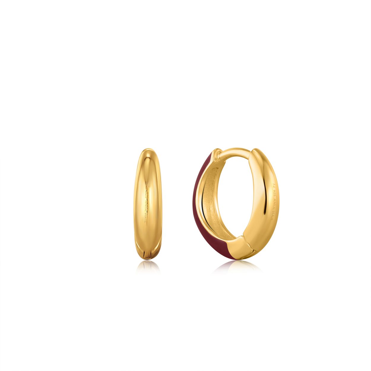 Deze oorringen zijn van het merk Ania Haie. Het is een damessieraad gemaakt van zilver. De oorringen zijn goud met rood/bruin emaille van kleur.
