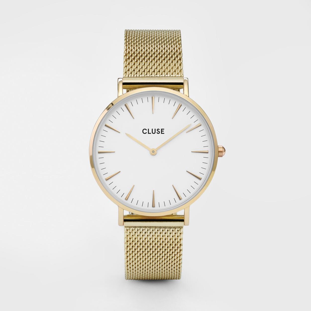 Eenvoud is de beste manier. Eerst de basis: klassiek goud en eierschaalwit. Dan de details die worden teruggeschroefd. Essentiële elegantie met een zeer moderne twist. Aangeboden in een grijze kunstleren etui. Zoals al onze horloges uit de Boho Chic-collectie, kun je dit horloge gemakkelijk personaliseren met elke Boho Chic of een 18 mm CLUSE leren of mesh armband.