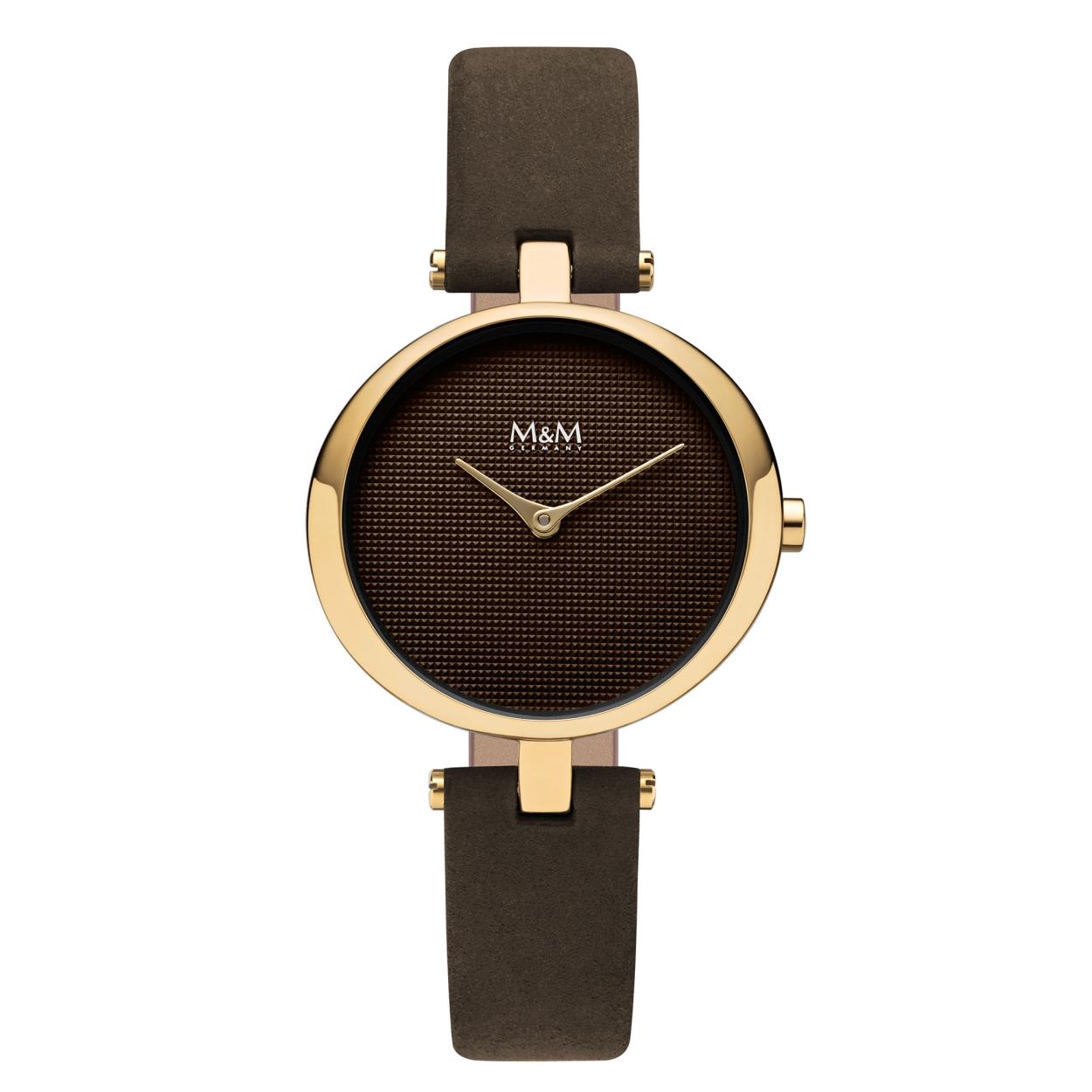 Dit M&M horloge is een dameshorloge. De diameter van de kast is 34 x 32 mm. De kast is goud van kleur. De band is gemaakt van nubuk-leder en is bruin van kleur. Het glas van het horloge is gemaakt van gehard mineraal. De waterdichtheid is 3 ATM.