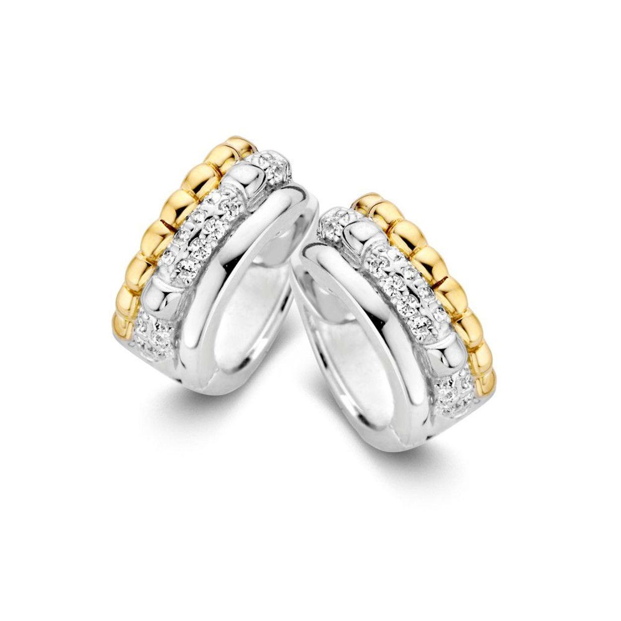 Zilver met 14 karaat gouden creolen en zirkonia Deze oorbellen zijn�onderdeel van een set.
