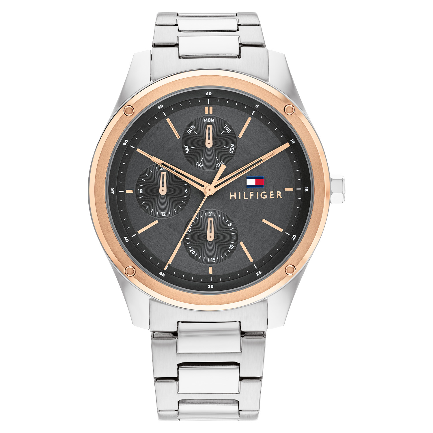 Dit Tommy Hilfiger horloge, uit de Tyler collectie, heeft een stalen band en kast met een rosé vergulde rand. De wijzerplaat is donker grijs met rosé kleurige indexen en wijzers