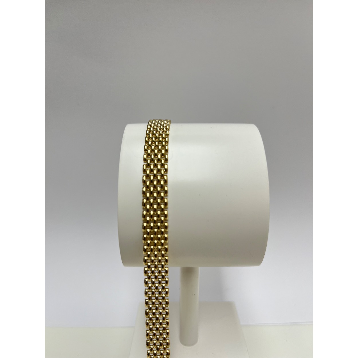 14 karaats geelgouden schakelarmband 7 rijig met stevige baksluiting en extra veiligheidsachtje