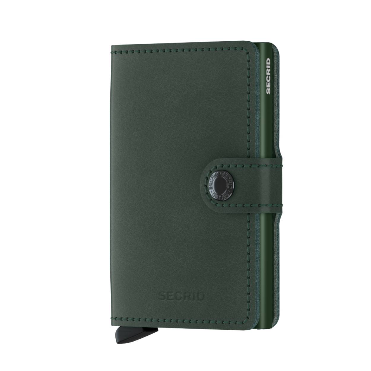 Miniwallet Original Green – Fris, Tijdloos en Functioneel

De Miniwallet Original Green is de perfecte mix van compact design en verrassend veel opbergruimte. Deze iconische portemonnee past gemakkelijk in elke broek- of jaszak, en is ontworpen voor dagelijks gebruik – of je nu onderweg bent naar werk, studie of op reis.

Dankzij het gepatenteerde mechanisme heb je met één simpele beweging snel toegang tot je belangrijkste kaarten, terwijl de stevige aluminium behuizing optimale bescherming biedt tegen buigen, breken en ongewenste draadloze communicatie (RFID-skimming).

Original – Vertrouwd Leer met Natuurlijke Glans

De kleur Original Green geeft een frisse draai aan onze meest universele leersoort. Het leer heeft een subtiele, natuurlijke glans en past moeiteloos bij elke stijl – van casual tot zakelijk. Niet voor niets is dit materiaal al jarenlang een vaste favoriet.

Original is gecorrigeerd leer, gemaakt in Nederland en Italië van hoogwaardige Europese runderhuiden. Wil je meer weten over de leersoorten, het productieproces of onderhoudstips? Bezoek dan onze leerpagina
.

Wat past er in de Miniwallet Original Green?

4 verdikte kaarten of 6 platte kaarten in de Cardprotector

4 extra kaarten in het leren omhulsel

Papieren bankbiljetten

Visitekaartjes

Bonnetjes

Specificaties

Afmetingen: 65 x 102 x 21 mm

Gewicht: 72 g

Garantie: 2 jaar

De Miniwallet Original Green is een stijlvolle, duurzame keuze voor iedereen die houdt van kwaliteit, eenvoud en een frisse uitstraling. Klein in formaat, groots in functionaliteit.