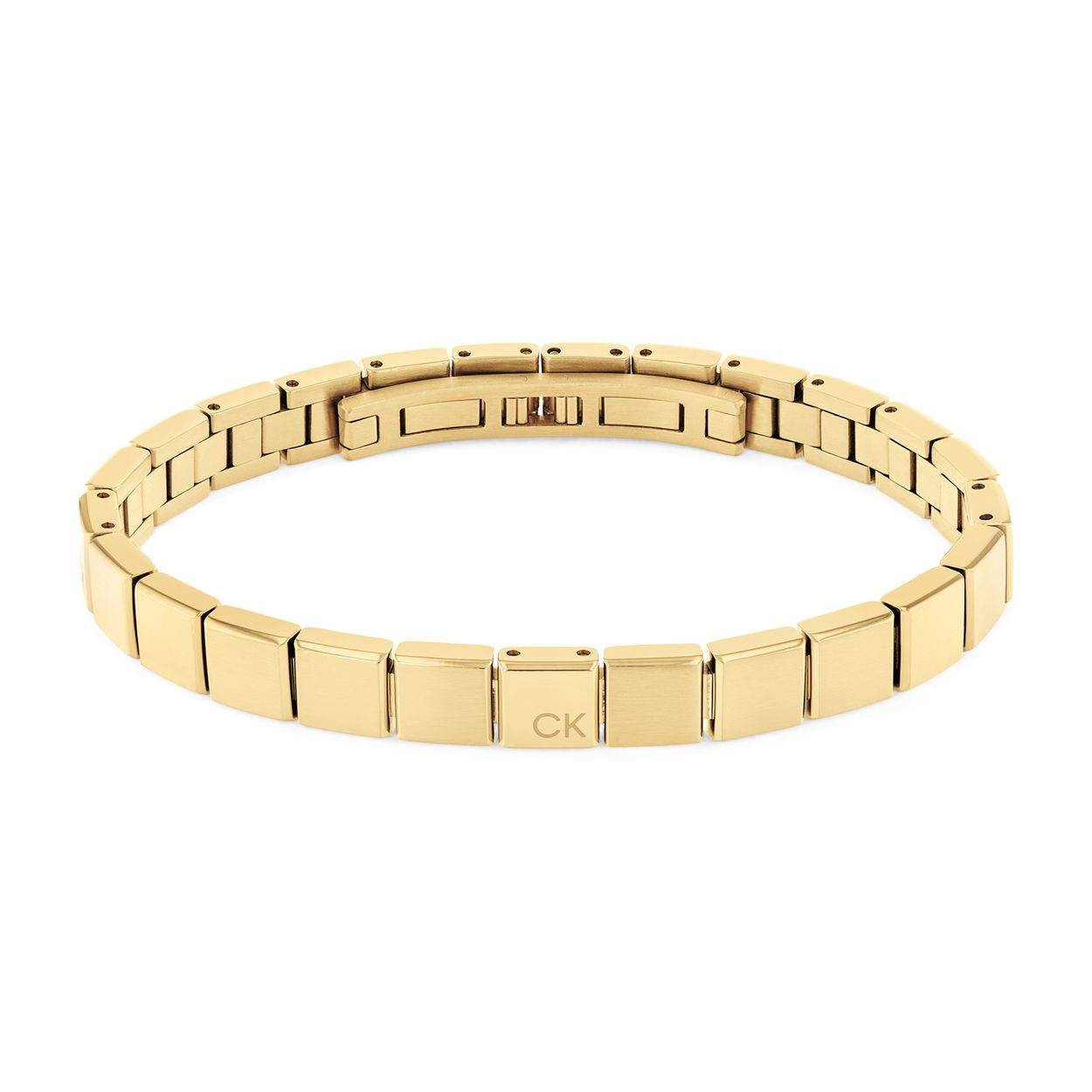 Calvin Klein Heren Armband Staal 
Deze stalen ketting van Calvin Klein is strak maar stoer. De goudkleurige stalen schakel armband bestaat uit vlakke vierkante plaatjes aan elkaar, de sluiting is een onzichtbaar vlinderslot. De armband kan ingekort worden door er enkele schakels tussenuit te halen. Op een van de schakels staat het CK logo gegraveerd. De armband heeft een lengte van 19,5cm. Leuk te combineren met andere sieraden uit de serie van Calvin Klein.
