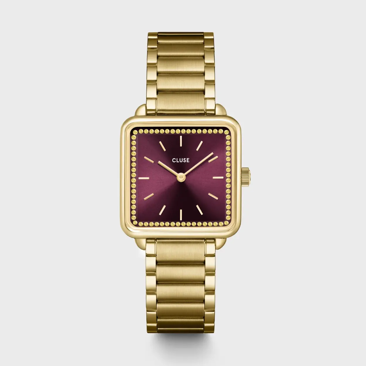 Het vierkante La Tétragone horloge voor dames heeft een 28,5 mm goudkleurige kast, een wijnrode wijzerplaat versierd met goudkleurige steentjes op de wijzerplaat en een 16 mm goudkleurig roestvrijstalen bandje.

Personaliseer je horloge eenvoudig met elk CLUSE 16 mm-bandje. De maat van het horlogebandje pas je gemakkelijk zelf aan.