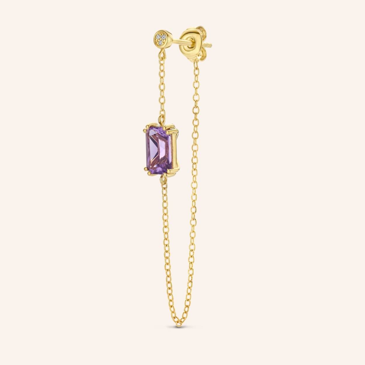 Referring to the black hellebore’s enchanting dark shades, this purple amethyst gemstone is where luxury and sensuality meet. Purple amethyst is known to promote healing, intuition and serenity and has been a symbol of royalty for centuries. A pendulous charm on a diamond (3x) stud, overfl owing with brilliance. STYLING TIP Pair up the Plum hoop and stud for an asymmetric and empowering look.

Ref: M2480 | Single Earring | 925 Sterling Silver | 90.00 x 3.00 mm | White Diamond: 3pc