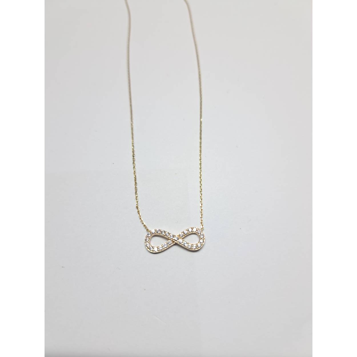 14 Karaat geel gouden collier infinity bezet met briljant geslepen zirkonia.