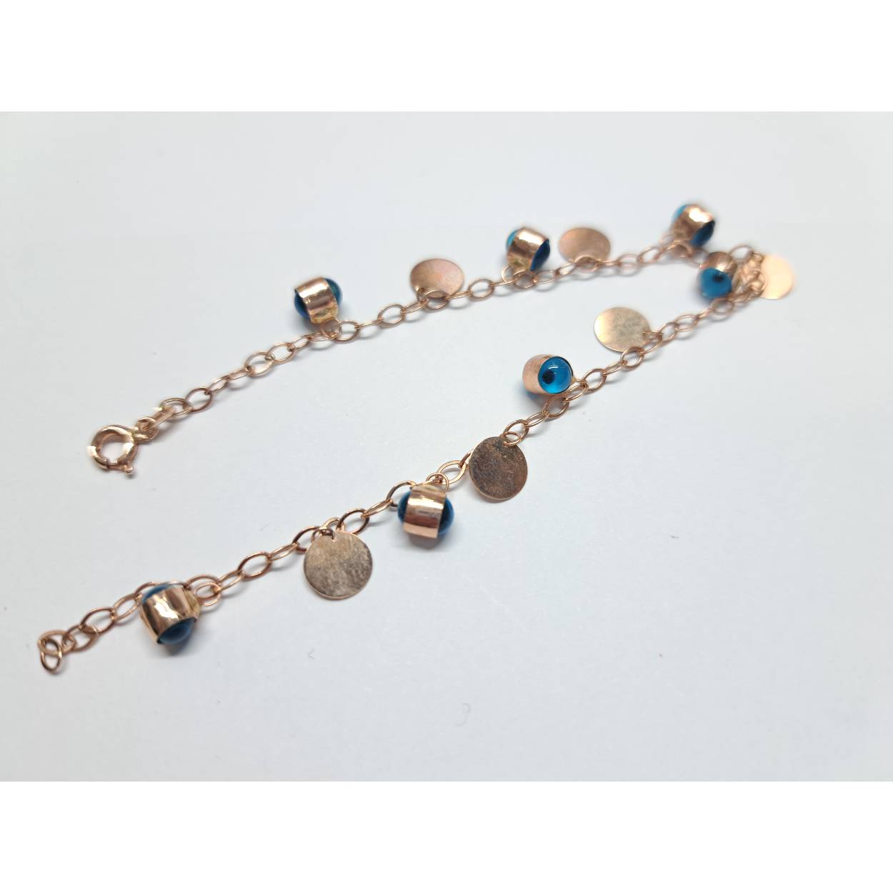 14 Karaat rosé gouden armband bezet met Nazar ogen. 