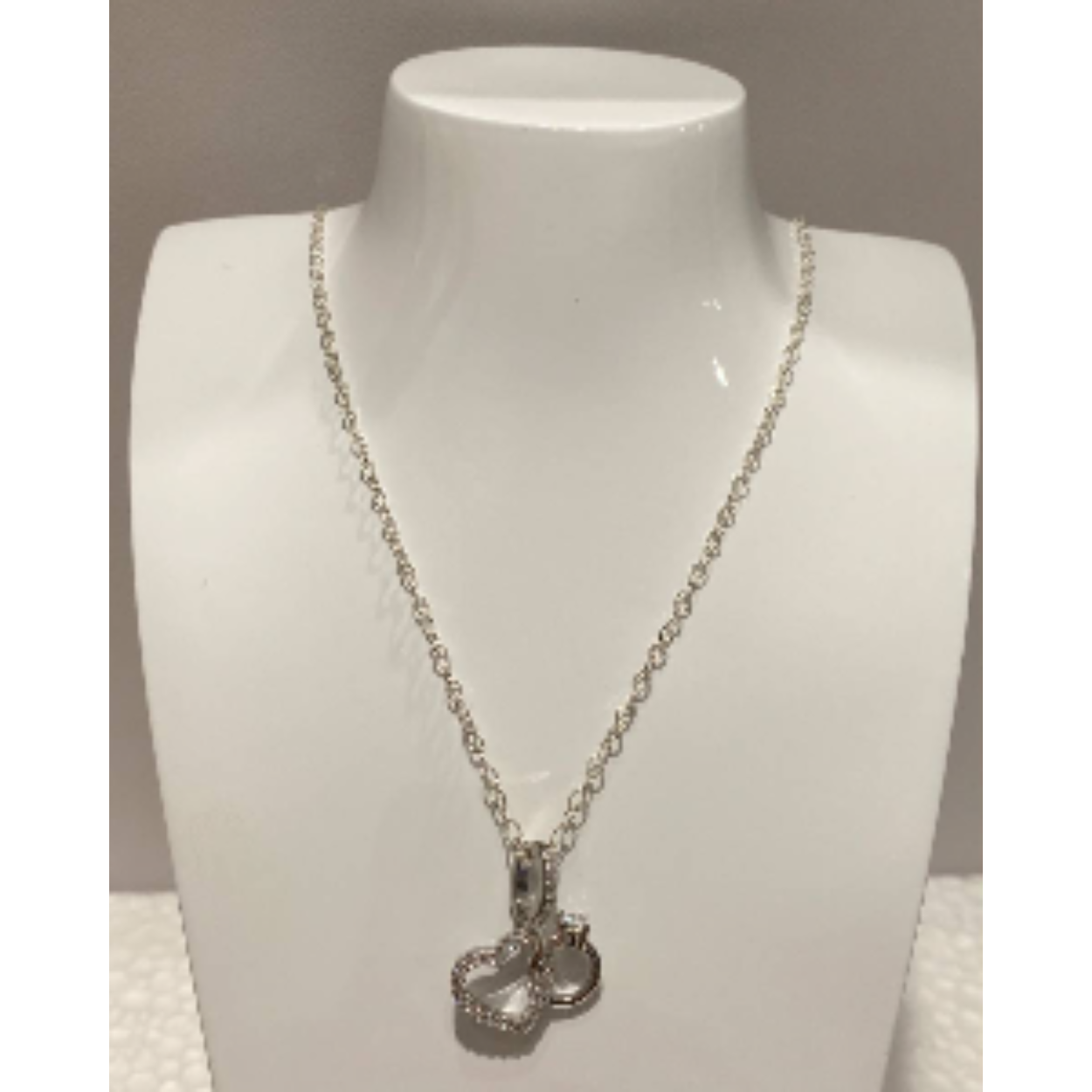 Zilveren collier ronde schakel met een hanger hart en ring bezet met zirkonia 