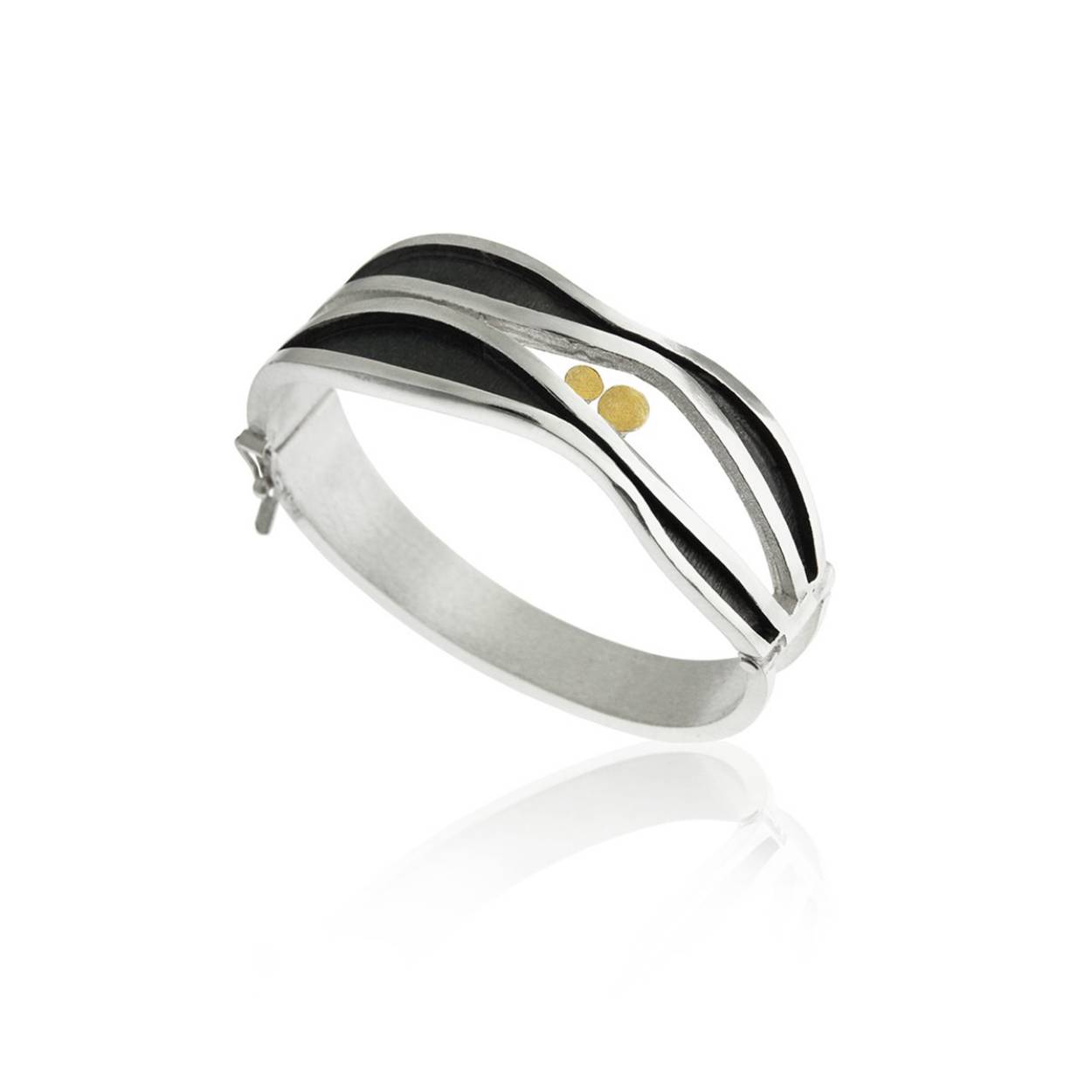 925 white silver bangle combined with oxidized silver and 18k yellow gold.
