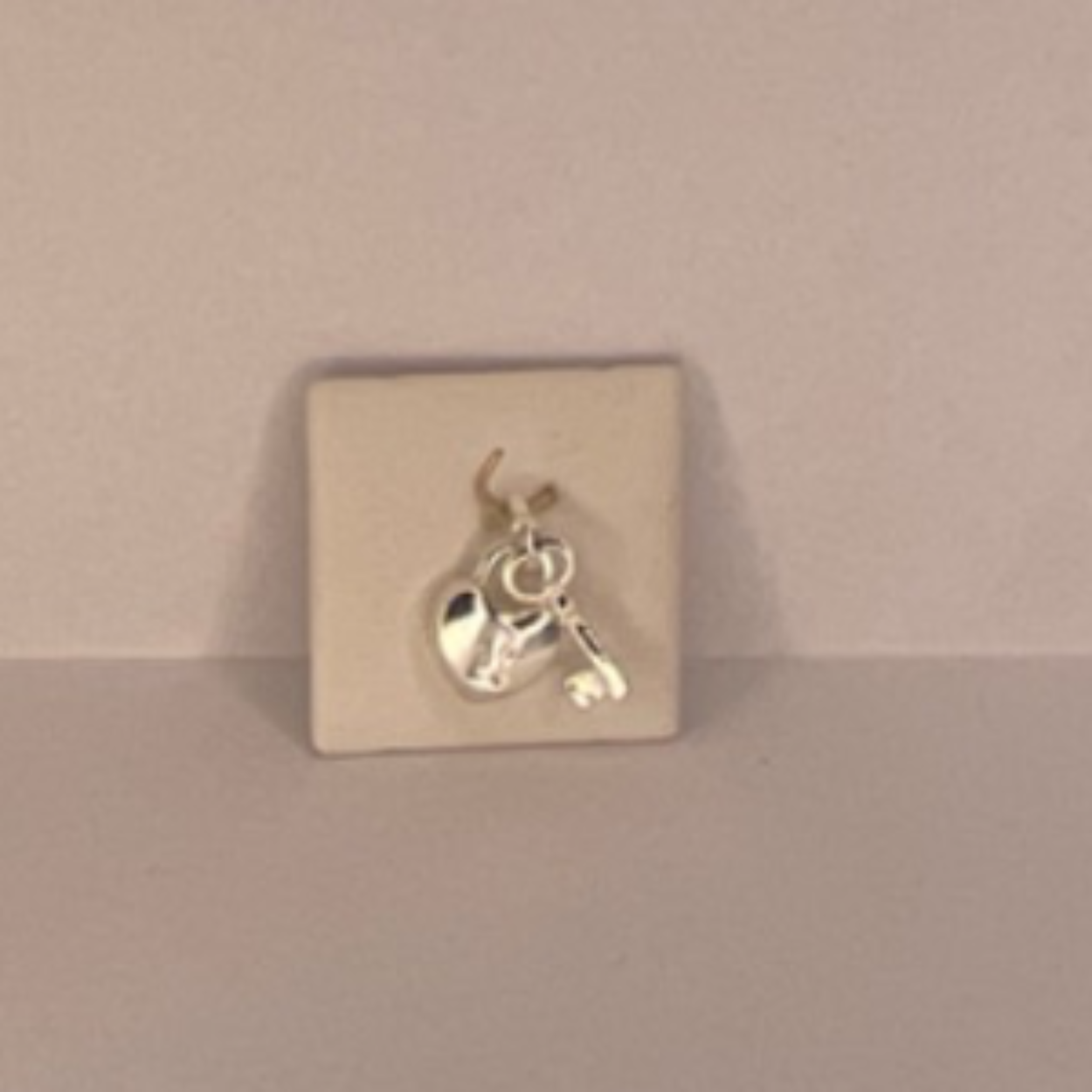 Zilver bedel hartje en sleutel