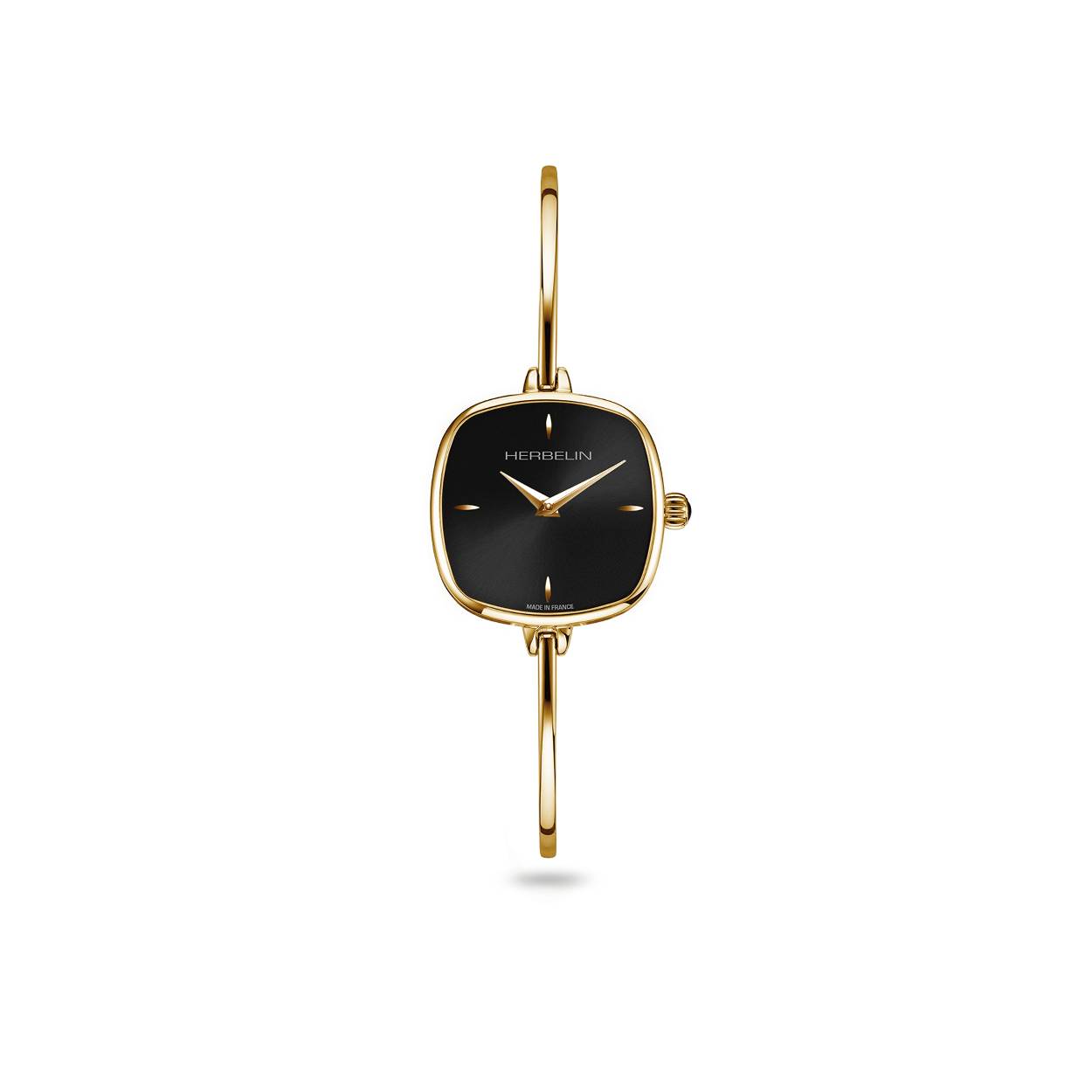 De Fil collectie belichaamt vrouwelijkheid en elegantie. De zwarte zonnestraal wijzerplaat is subtiel afgewerkt met discrete indexen in geelgouden PVD. De fijne, rigide armband siert de vrouwelijke pols met delicatesse en moderniteit.