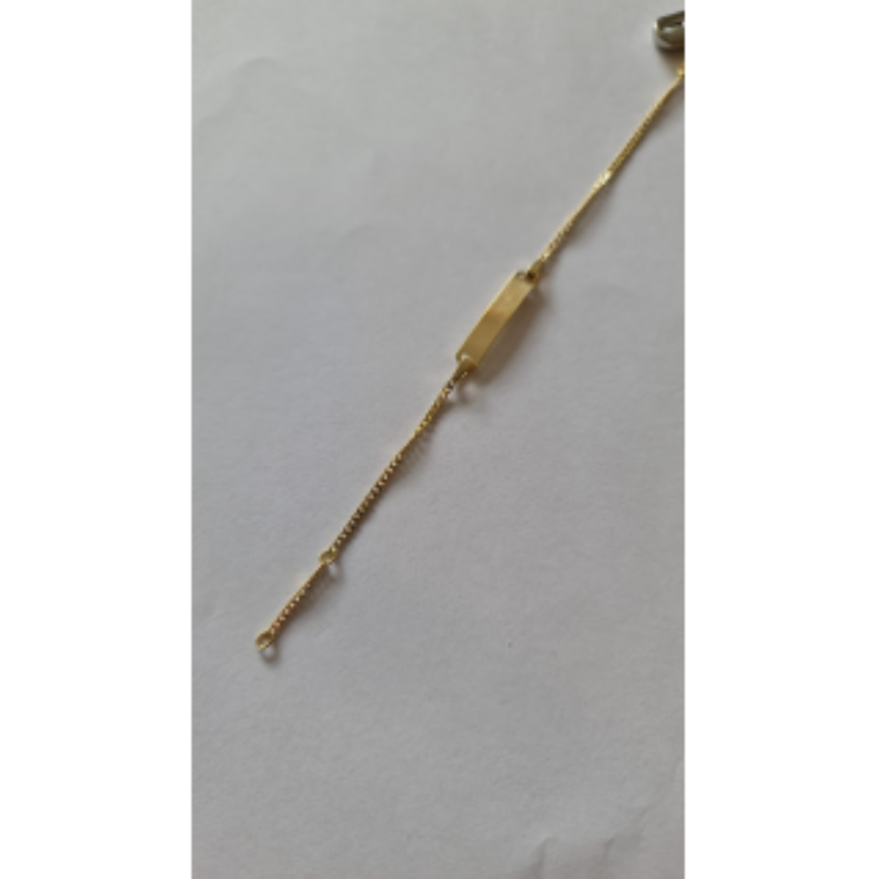 14 karaats gouden graveerarmband met zilveren kern.
13-15cm