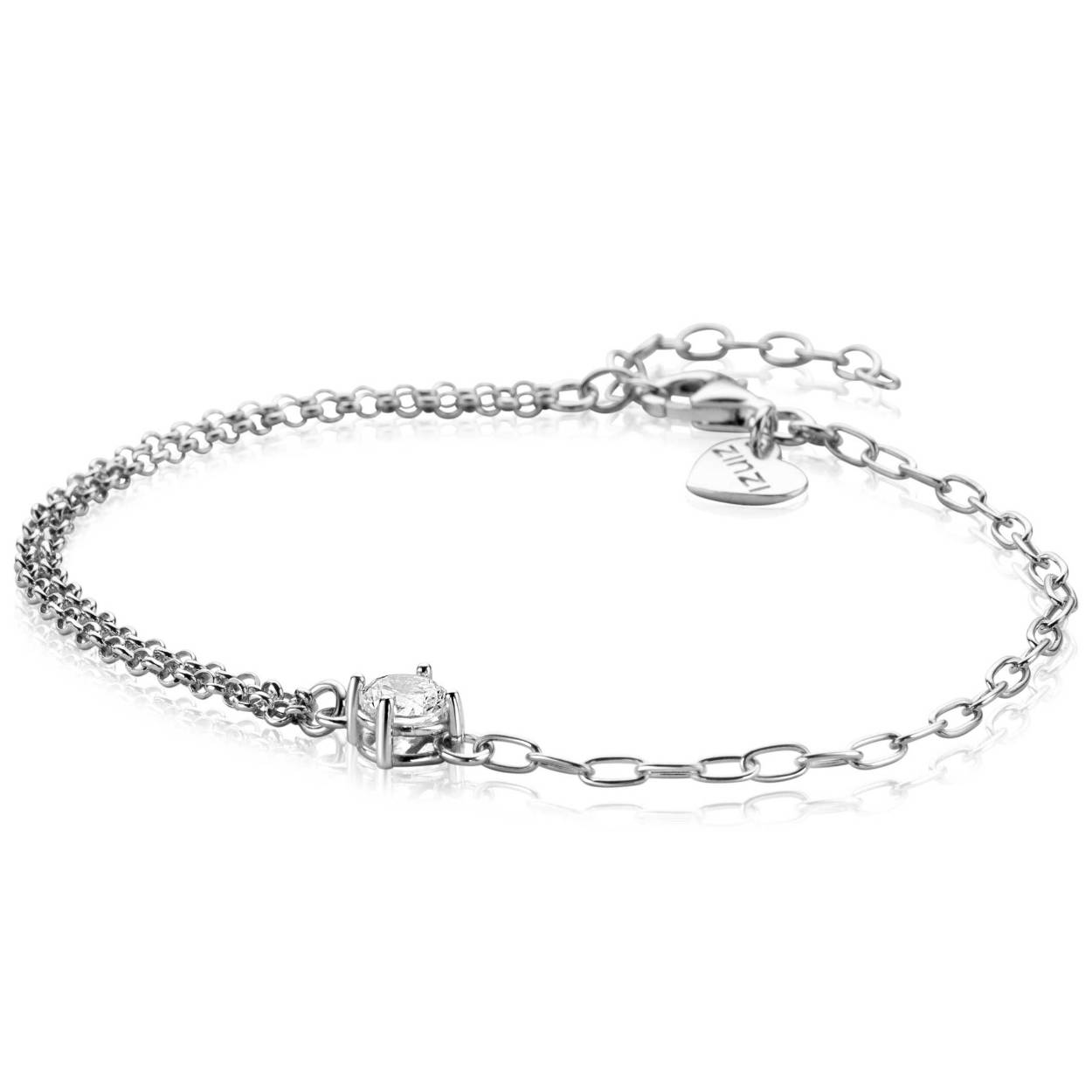 ZINZI zilveren multi-look armband met een subtiele dubbele jasseron schakel aan de één zijde en aan de andere kant een enkele ovale schakel. Tussen de twee schakels zit een ronde witte zirkonia in een vierpootszetting. Combineer de armband met de bijpassende kettingen en oorknoppen voor een chique uitstraling. De lengte van de armband is te variëren tussen 17cm en 19cm. Vervaardigd van eerste gehalte zilver (925) en voorzien van een extra rodiumlaag voor een langdurige glans.