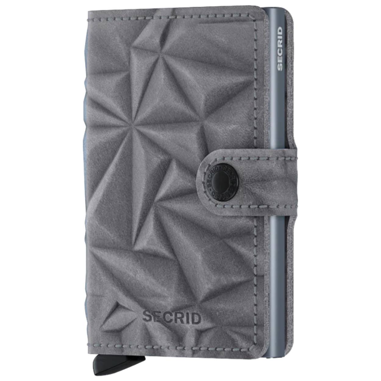 Small in size and surprisingly large in storage capacity, the Miniwallet combines the best of both worlds. The exterior holds banknotes, receipt and cards, while the aluminium Cardprotector allows you to slide out cards with one simple motion and protects them from bending, breaking and unwanted wireless communication.


Holds

4 embossed or 6 flat cards

4 extra cards

Banknotes

Business cards