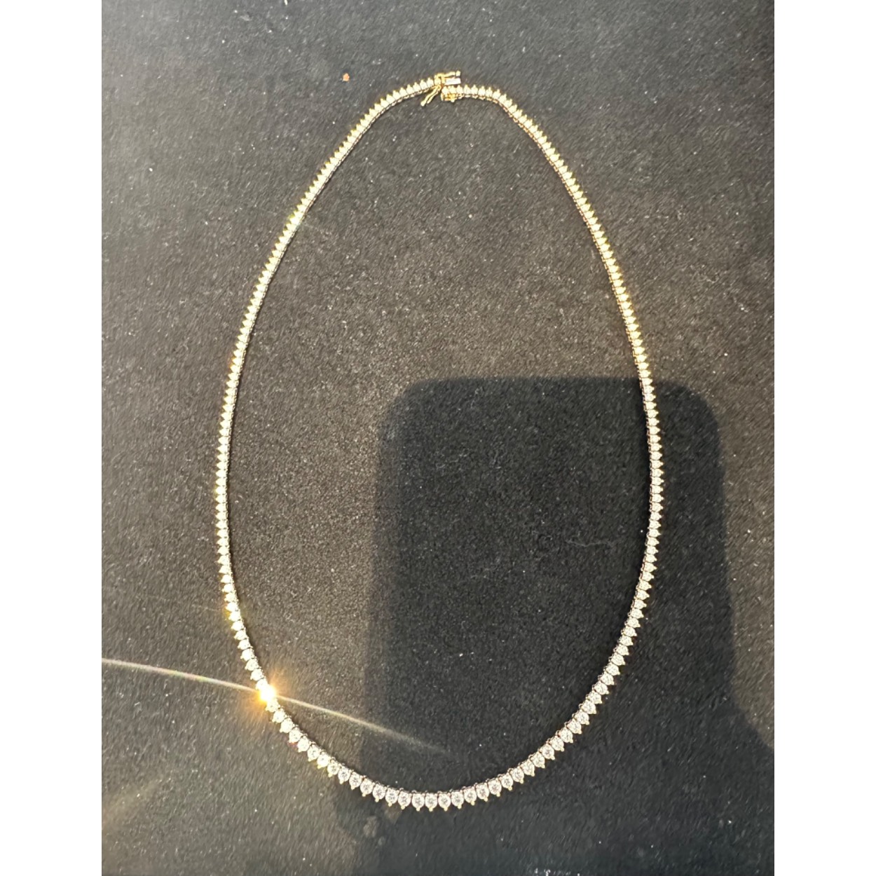 18kt. Geelgouden tenniscollier oplopend, 51-3.05/156-4.07=7.12ct G/Si
