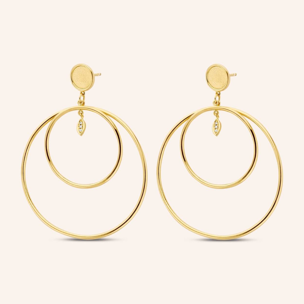 Spectacular double hoops with lemon-like diamond marquise shaped ornaments, hinting to Amalfi’s famous limoncello production. These head-turning earrings will surely leave you in equally high spirits.

Styling tip: Complete your piercings with our Golden Eye single hoop and stud.