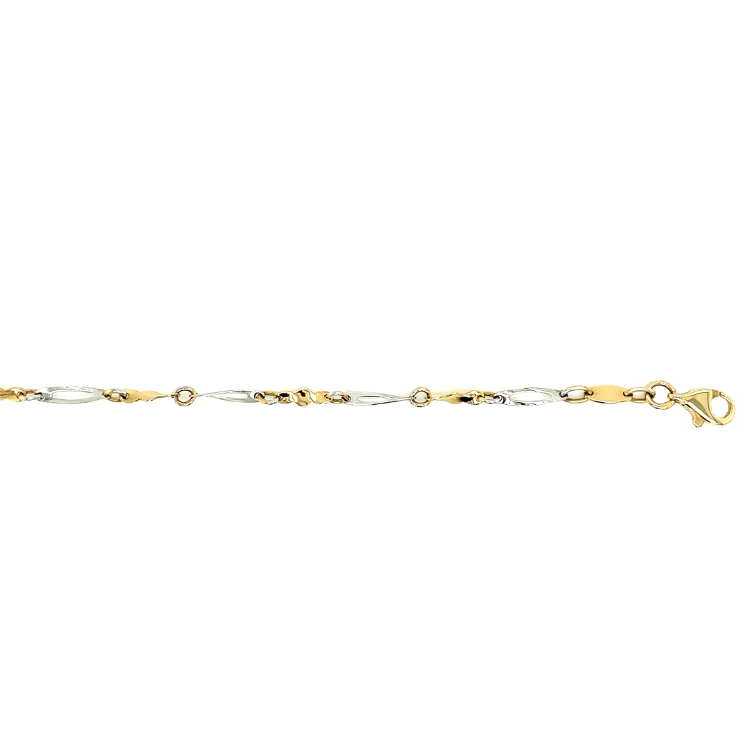 Deze bicolor gouden enkelband is fantasie geschakeld. De enkelband heeft witgouden schakels en geel gouden schakels.
