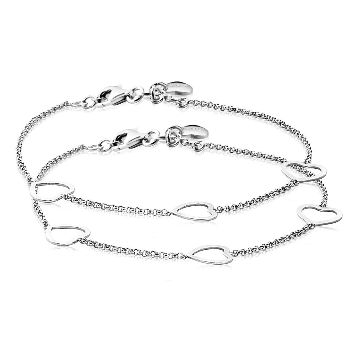 ZINZI set van 2 zilveren armbanden met fantasie schakels gecombineerd met drie open harten. 'Altijd met elkaar verbonden' door deze 2 armbandjes. Geef dit armbandje aan je moeder, vriendin of zus en draag zelf de ander. Met herkenbaar Zinzi hartje bij de sluiting. De lengte is te variëren tussen 17 en 20cm. Vervaardigd van eerste gehalte zilver (925) en met extra rodiumlaag voor een langdurige glans. Ook leuk in combinatie met andere zilveren armbandjes!
