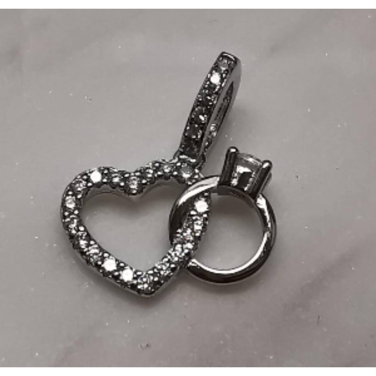 Zilveren hanger open hart zirkonia met een solitaire ring 