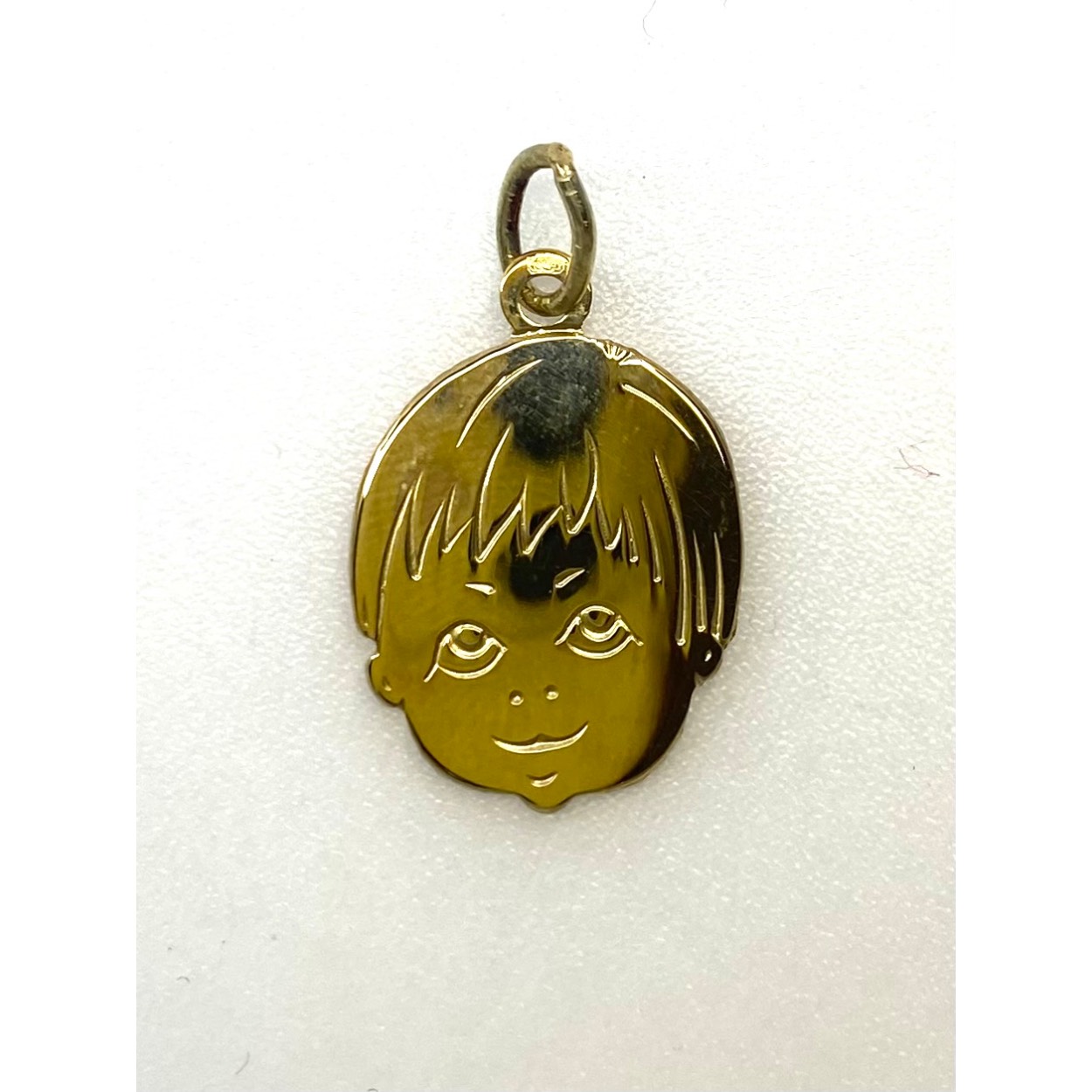 Gouden kinderkopje jongen 17 x 14 mm