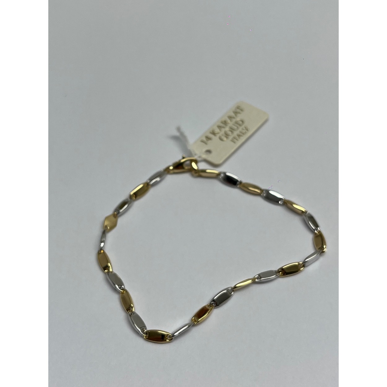 14 karaats Gouden schakelarmband

Geel en wit goud