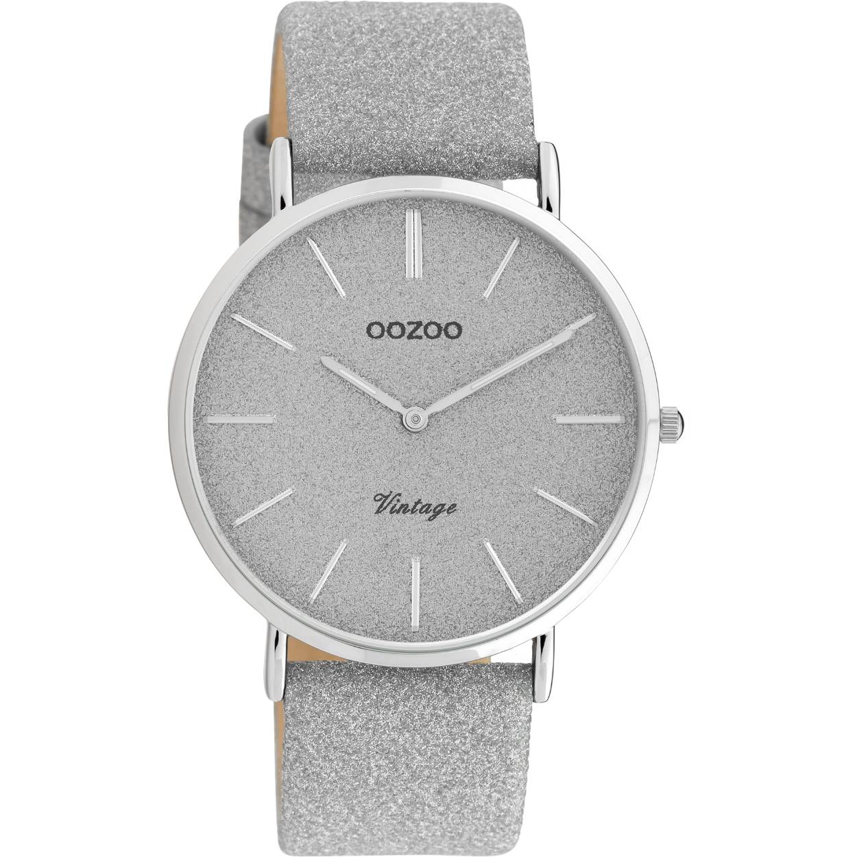 The classic look stays key in this trendy series and therefore, this vintage round design with a playful wink is the season must-have! This ladies watch is the perfect combination of fashion and comfort with its 40 mm Silver metal watch case and silver glitter dial. The glitter silver leather strap makes this watch a trendy accessory, which you can wear every day. The dial has silver stripes digits and matching hands. This watch adds the sparkle to your outfit. The mineral glass lays in a 6,9 mm slim metal watch case with IP-plating. This design has a stainless steel backplate and is nickel safe. This watch has a 2ATM Japanese movement and is covered by a 2 year warranty (see section 3 of our Refund, shipping & warranty policy).

