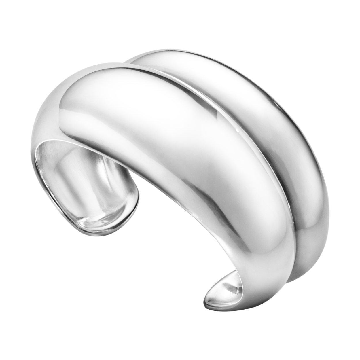 Two perfectly proportioned curves of sterling silver meet with a sharp line that contrasts with their softness in this bold, sculptural bangle. Continuing Georg Jensen’s heritage of organic jewellery, the bangle wraps naturally around the wrist making it easy and comfortable to wear.