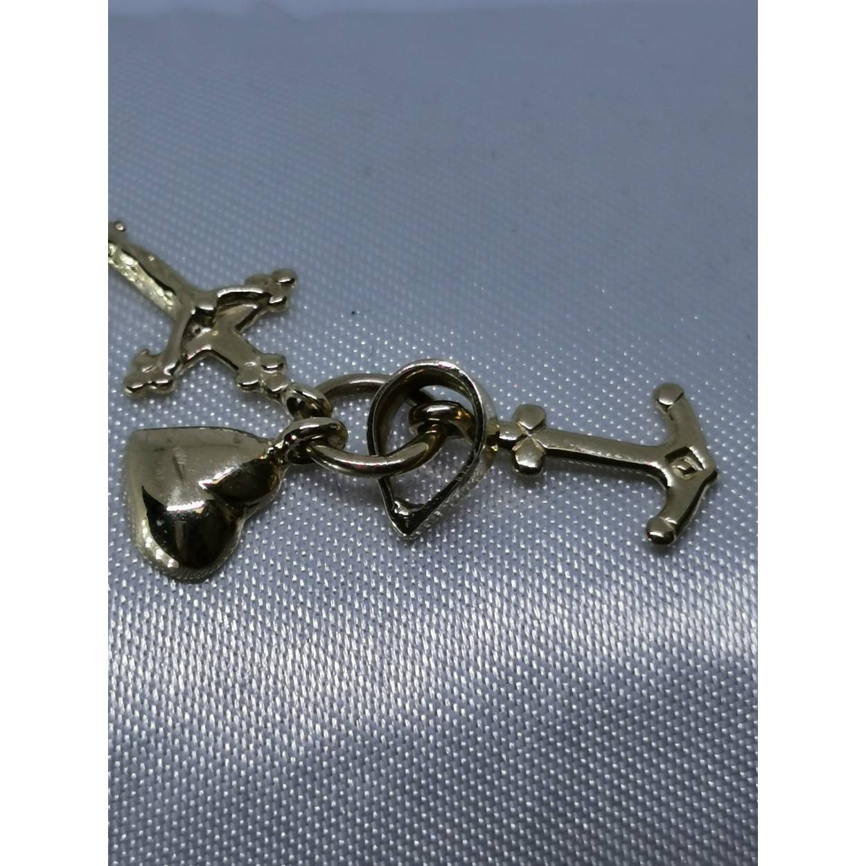 14 Karaat geel gouden hanger/bedel geloof/hoop/liefde in de vorm van een kruis, anker en hart. Combineer deze hanger met een leuke collier uit ons assortiment!