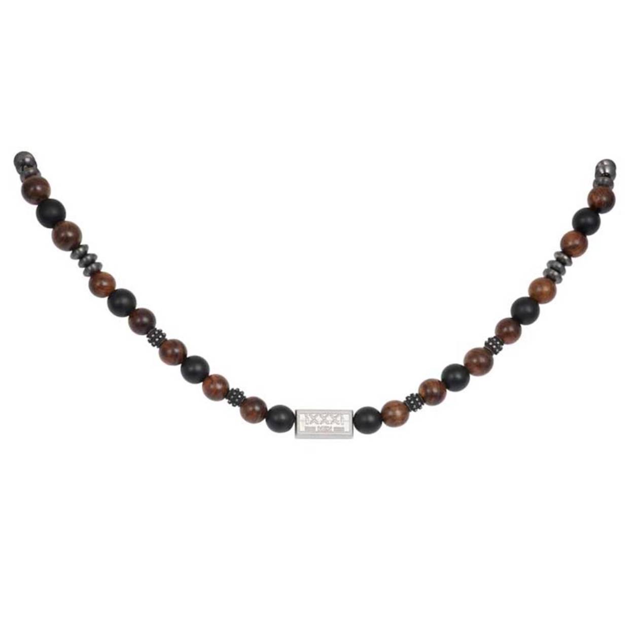 De iXXXi MEN ketting Boho Wood bestaat uit de materialen stainless steel in de kleur antiek zilver en zwart en is gecombineerd met zwart- en bruinkleurige houten kralen. De ketting is een kralenketting waarbij een patroon van zwarte en bruine kralen met verschillende antiek zilveren stalen details worden afgewisseld. In het midden van de ketting bevindt zich een rechthoekig detail in een zilveren kleur met de tekst 'iXXXi MEN' erop gegraveerd. De iXXXi ketting Boho Wood heeft een lengte van 45 cm. Mix & match deze ketting met bijvoorbeeld armband Kenji en maak jouw look compleet.
