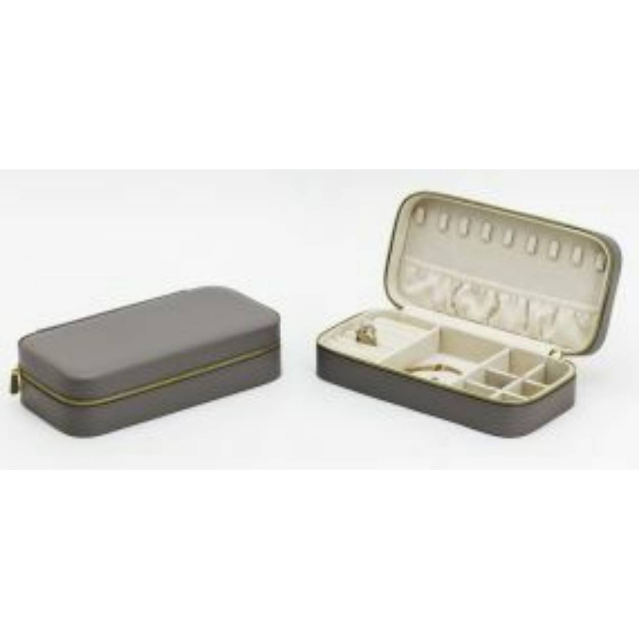 Luxe sieradenbox in de kleur grijs uitgevoerd met een goudkleurige rits sluiting en verschillende vakjes. Een compacte box om verschillende sieraden in op te bergen.