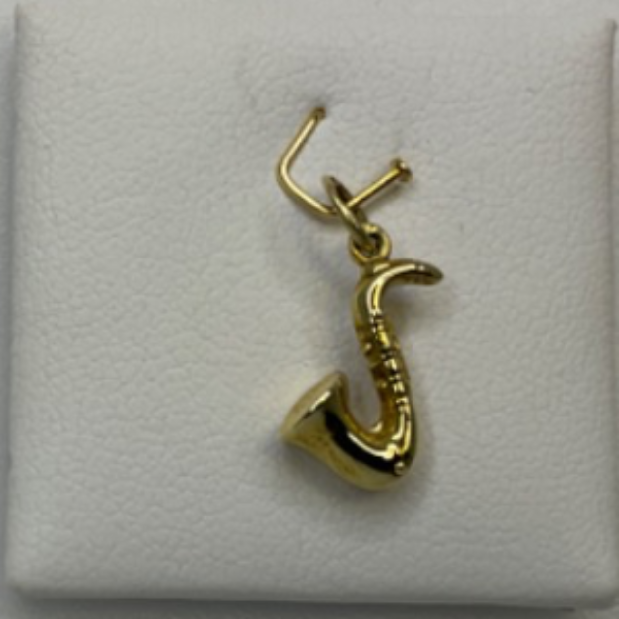 Saxofoon gouden bedel