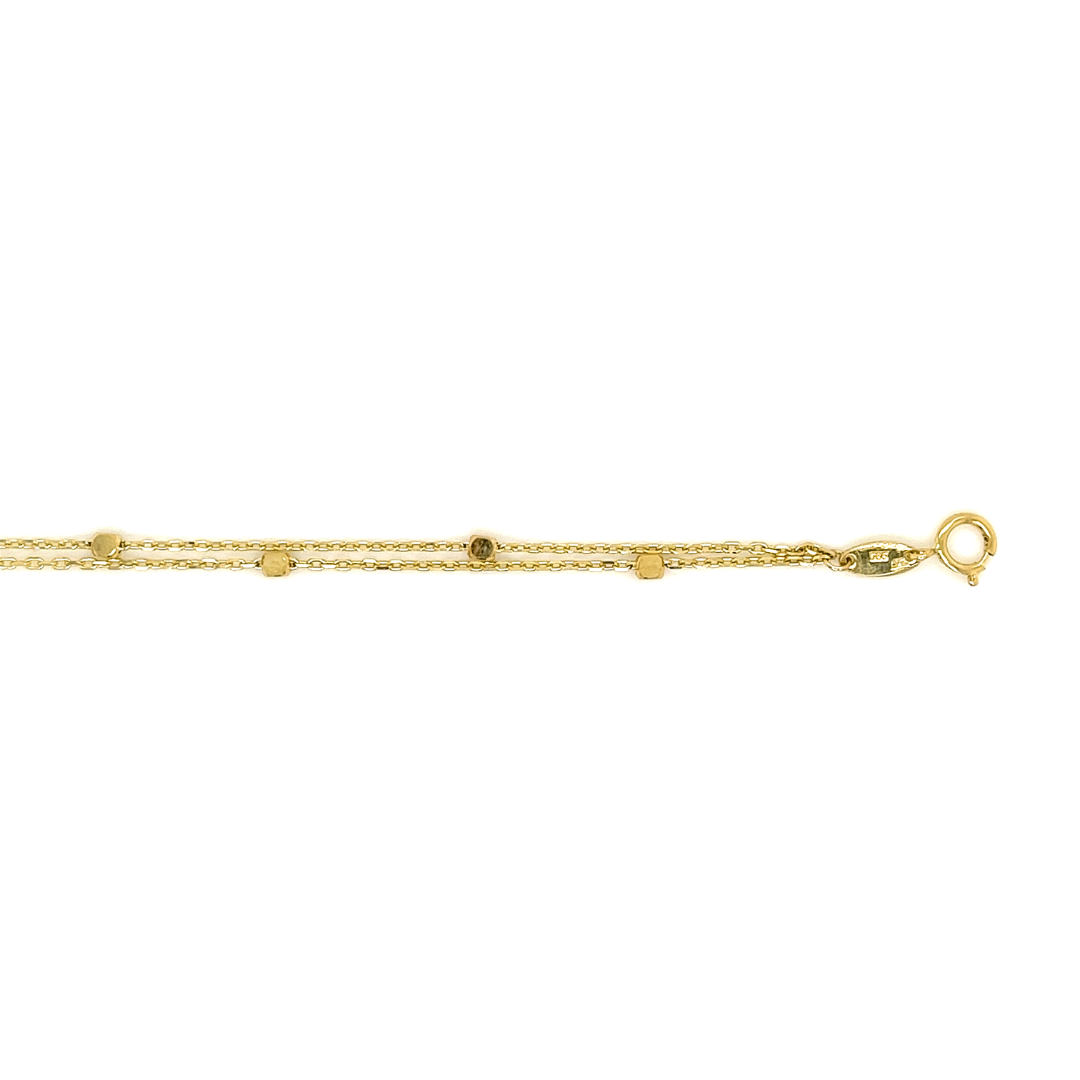 Deze 14-karaats geel gouden armband heeft een speelse uitstraling, dit komt door de dubbele armband. De ankerschakel wordt onderbroken door gouden blokjes. Deze armband is perfect voor iemand die houdt van geelgoud!

Armband GAS158WRSM is een set met collier GCS127WRSM.
