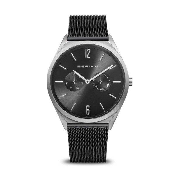 Bering heren horloge met een zwarte milanese band. zilverkleurige kast.