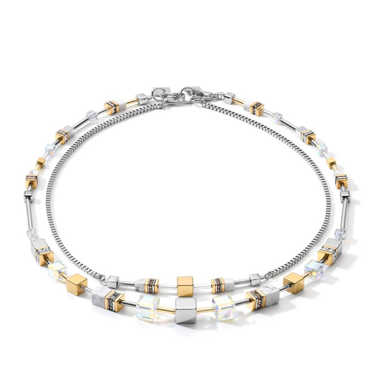 Een nieuwe kijk op de klassieke Geo Cube®, deze elegante "Natural Selection" kettingen van howliet, Europees kristal, hematiet met zilveren titaniumoxide afwerking, glas & strass rondellen in roestvrij staal kunnen als 2 aparte gedragen worden, of samengevoegd worden om een extra lange stijl
