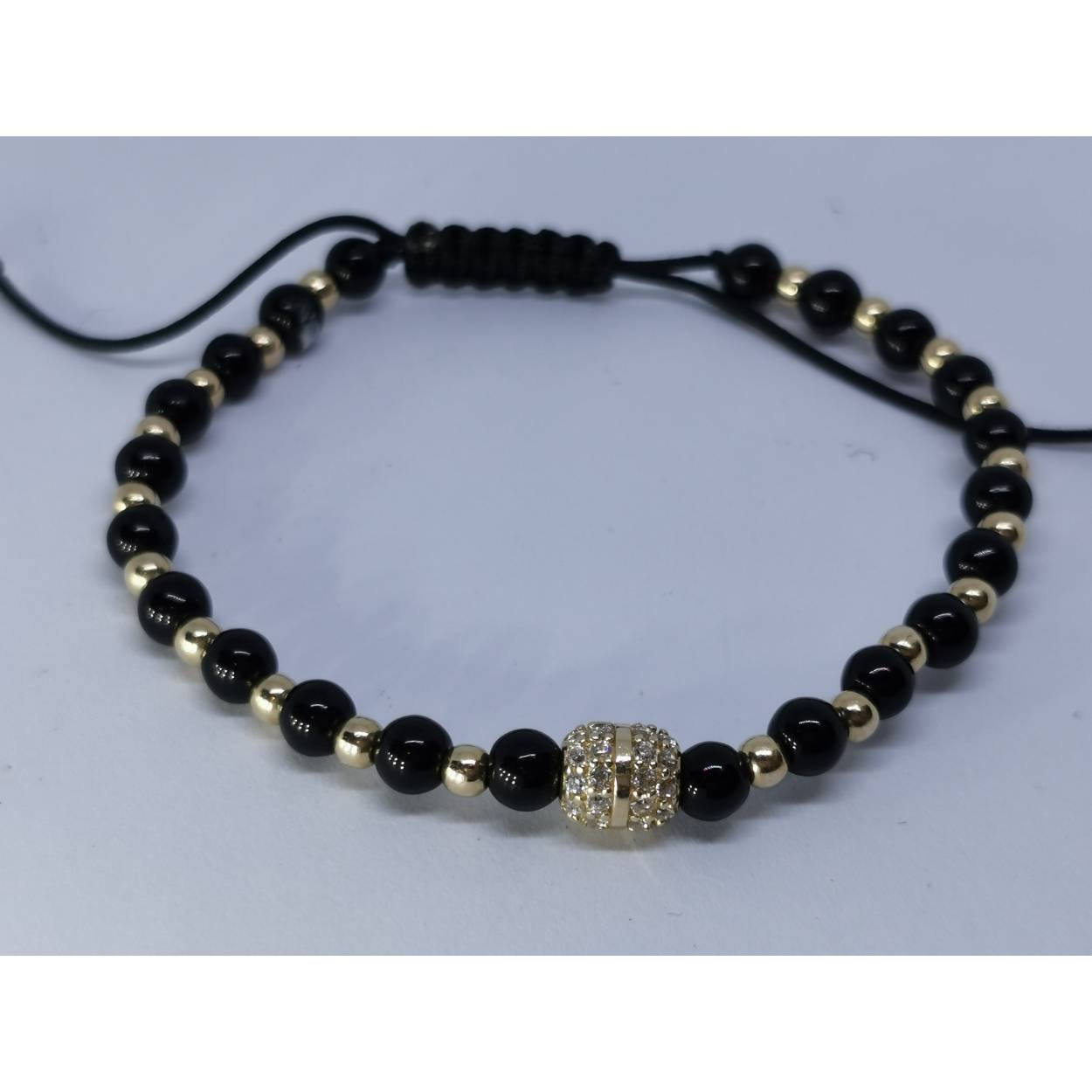 14 Karaat geel gouden armband met zirkonia en zwarte kralen