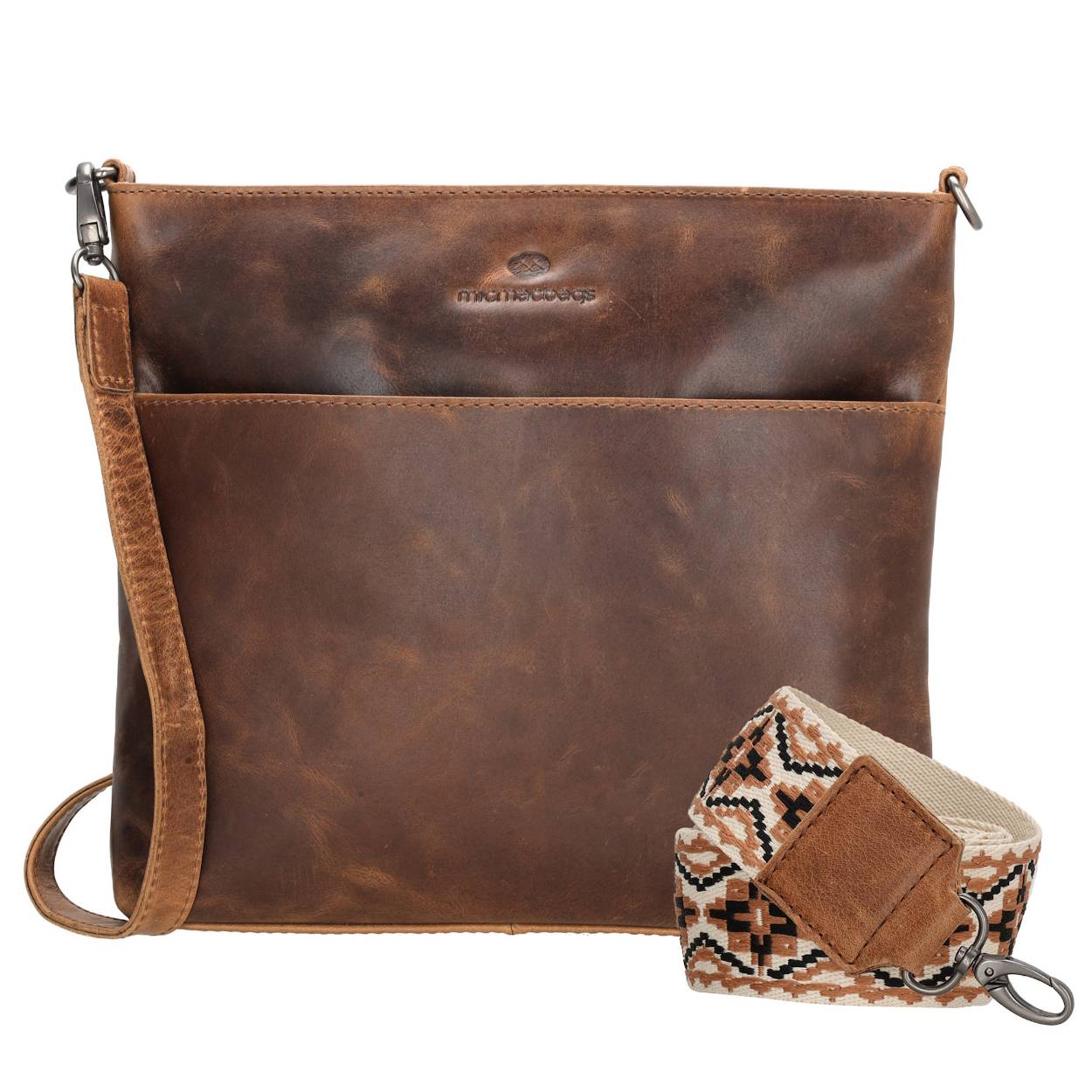 De lederen schoudertas van Micmacbags is de ideale metgezel voor wie elegantie en functionaliteit zoekt. Met een extra schouderband biedt deze tas veelzijdige draagopties, zodat hij perfect aansluit bij jouw unieke stijl.

Het handige extra voorvak is ideaal voor kleine items, terwijl het ruime hoofdvak voldoende plaats biedt voor belangrijke spullen die je graag goed beschermt – dankzij de veilige ritssluiting. Compact van formaat en toch ruim genoeg voor je dagelijkse benodigdheden, is deze lederen schoudertas van Micmacbags een onmisbare accessoire voor vrouwen die op zoek zijn naar een kleine, stijlvolle tas die ook nog eens praktisch is.