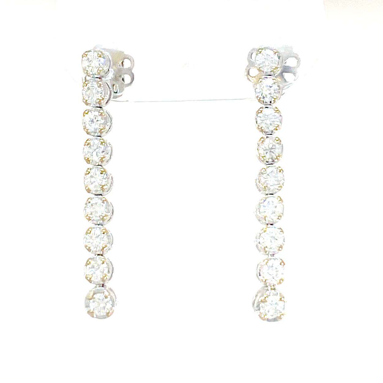 slinger oorbellen in 18kt goud met 1.35ct diamant
