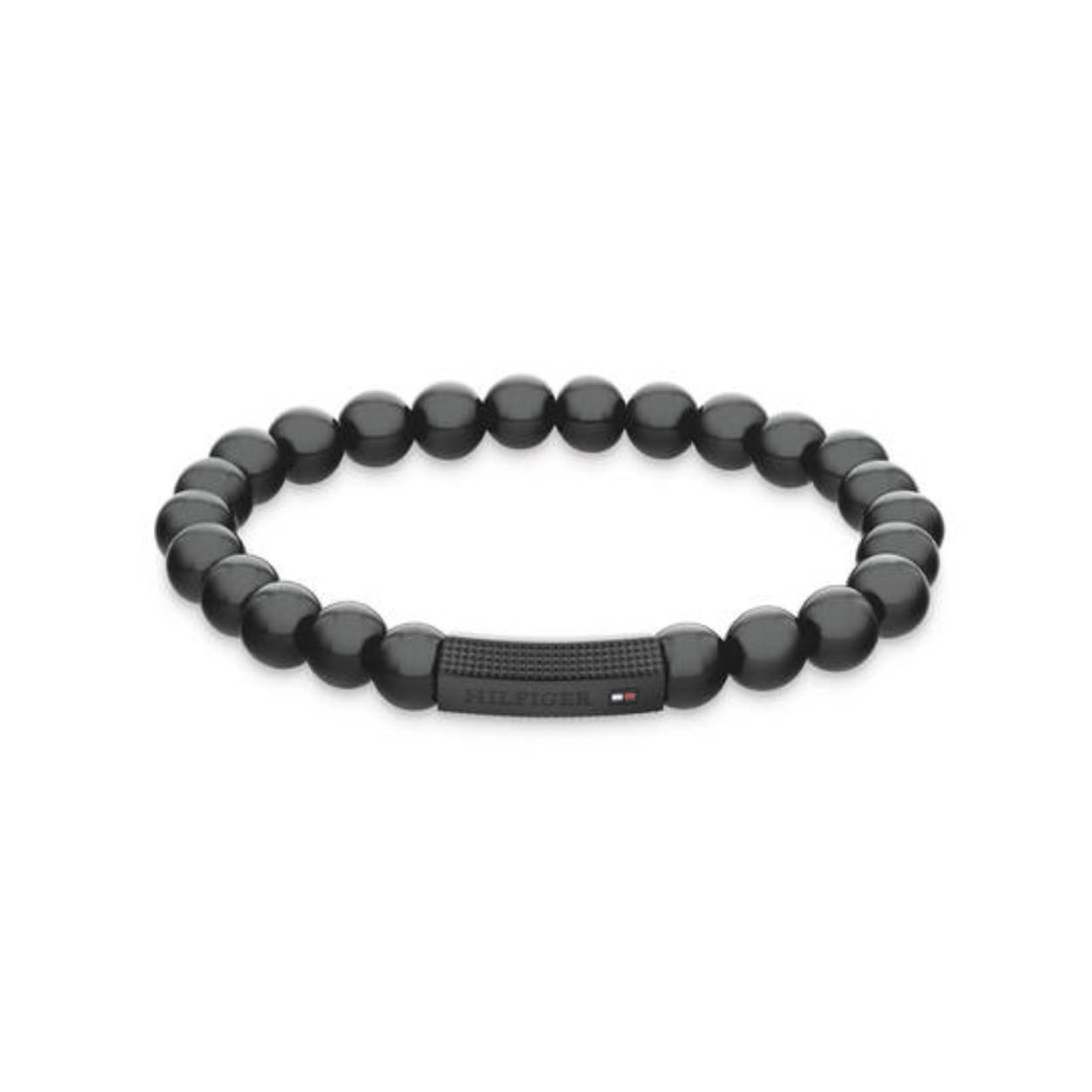 Tommy Hilfiger Jewels TJ2790581 Armband Heren Onyx 18cm
Deze armband van Tommy Hilfiger uit de jewelry serie met nr: TJ2790581 is een opvallend model. De heren armband heeft zwarte onyx kralen geregen op elastiek draad. Tussen de edelstenen zit een zwart stalen stuk waarop het logo van Tommy is gedrukt. De armband is geschikt voor een pols van ong. 18cm. Ook leuk te combineren met andere armbanden en sieraden van Tommy Hilfiger.

Het merk:
Tommy Hilfiger is wereldwijd één van de grootste designer lifestyle merken en is internationaal bekend om haar classic American cool stijl. De sieraden zijn voor dames en heren met een eigen stijl, die niet bang zijn om dit aan de wereld te laten zien.

Specificaties:
- Kralen armband
- Materiaal: Onyx Zwart
- Rekbare lengte 18cm
- Heren sieraad